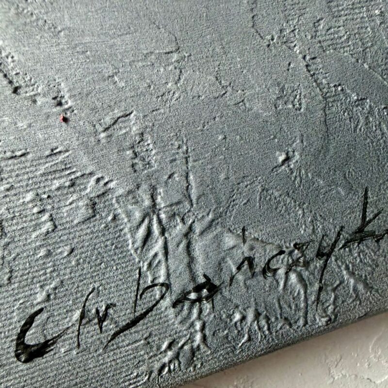 obraz kolorowe miasto w ramie podpis autora